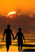 Couple walking into the sunset